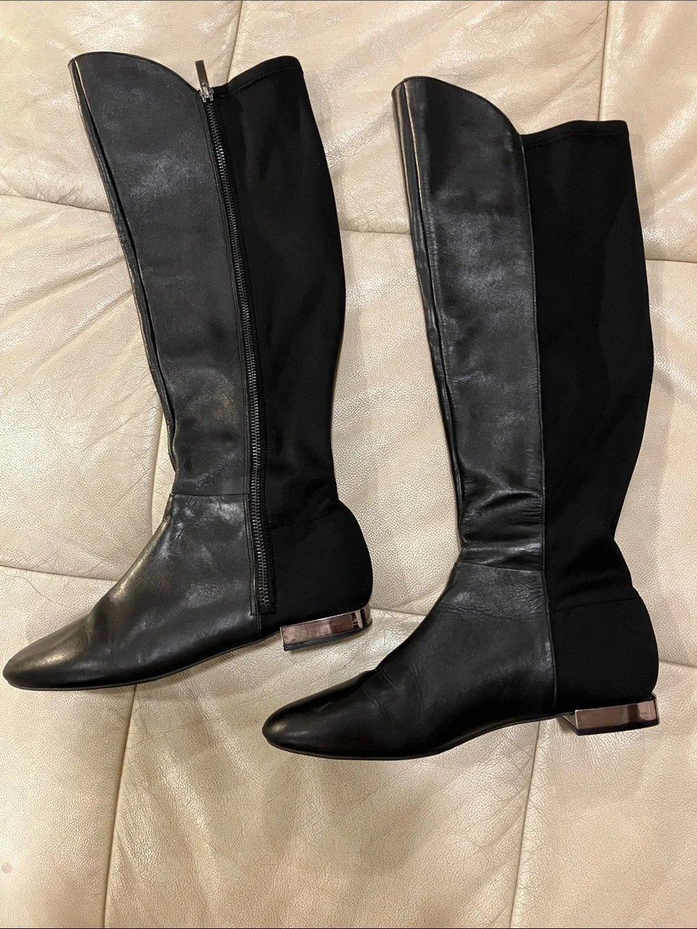 Sleek Black Over-the-Knee Boots with Metallic Accent Heel